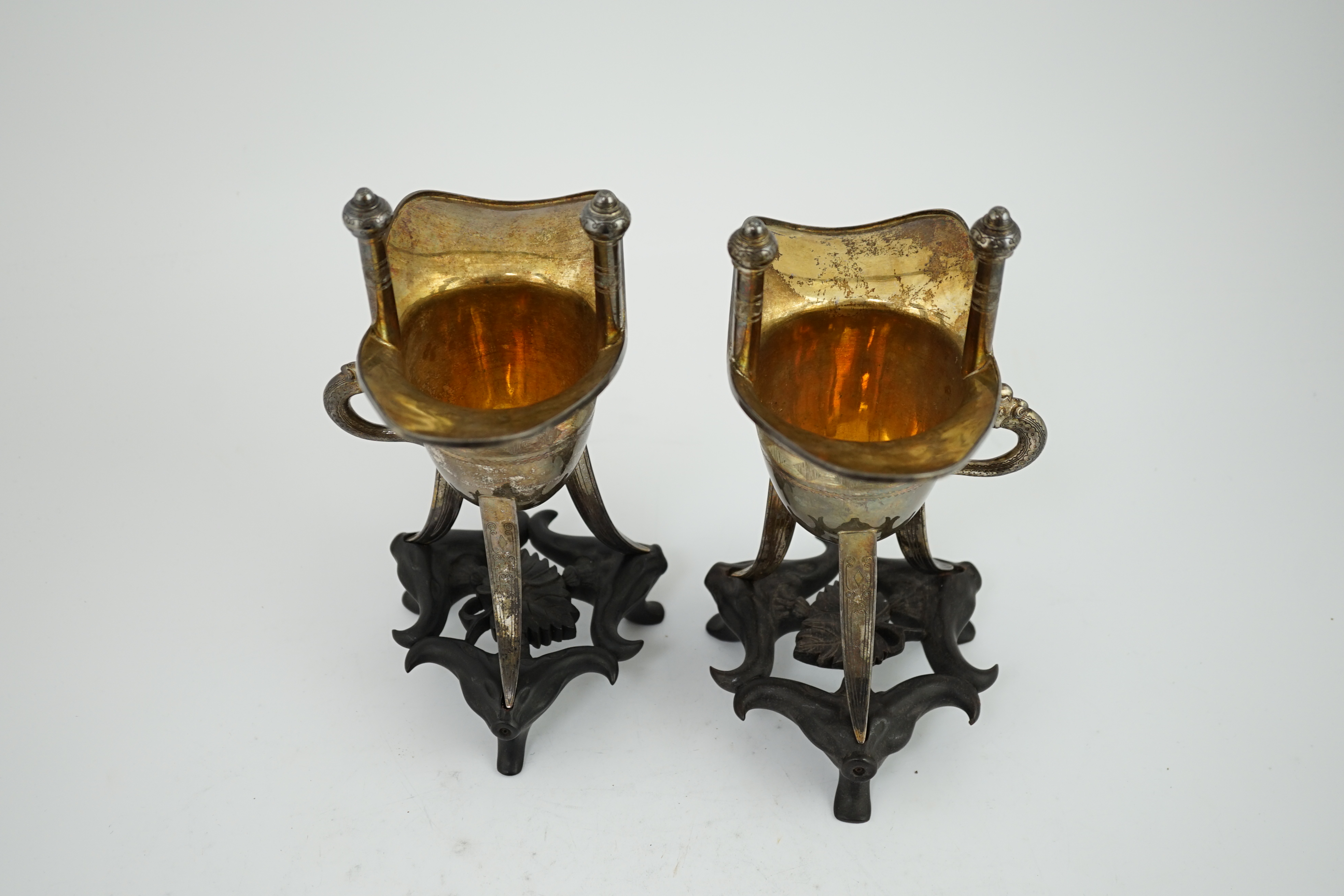 A pair of early 20th century Chinese archaistic silver 'Jue' wine cups, by Wang Hing, Hong Kong